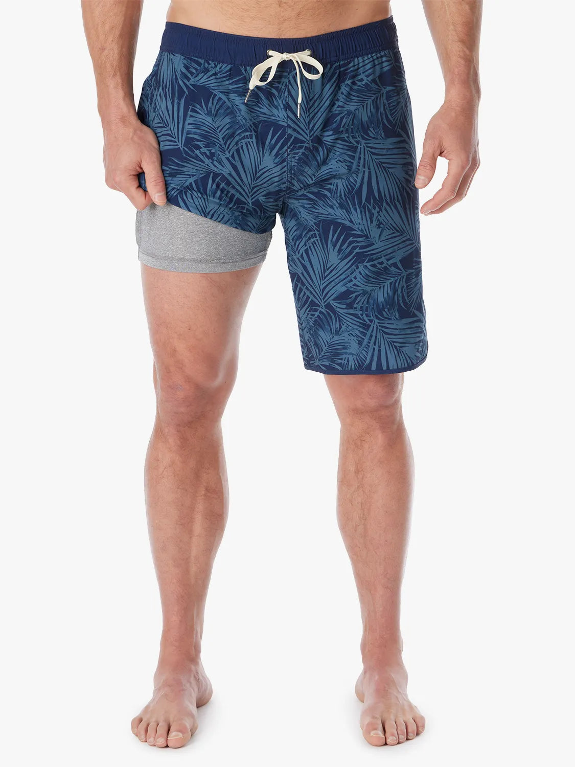 Person wearing grey and navy floral  patterned Anchor Trunk in 10 inch inseam, showing liner on a white background