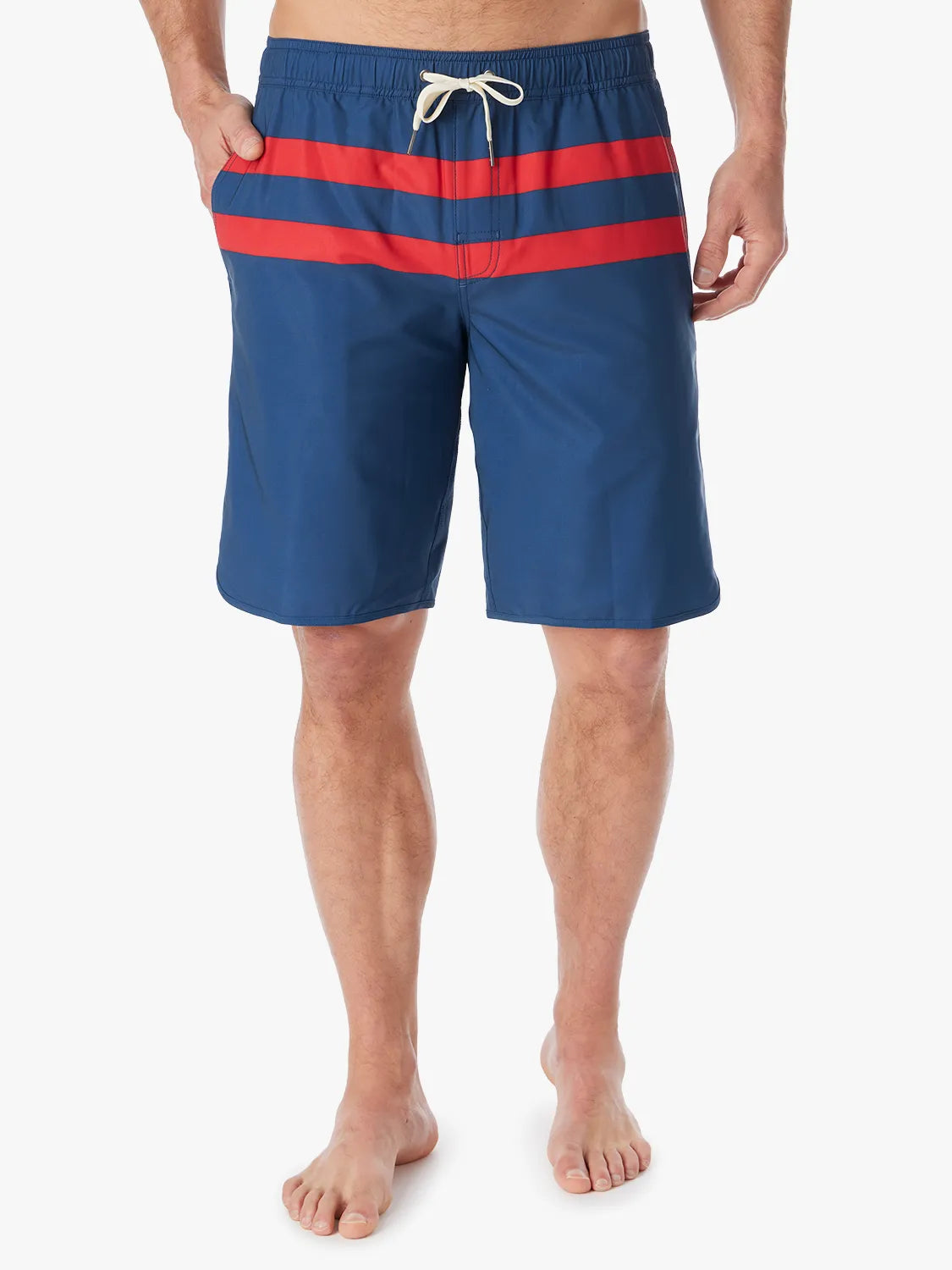 A person wearing a pair of 10 inch navy anchor trunk shorts with two red horizontal stripes and a drawstring waist with a white background.