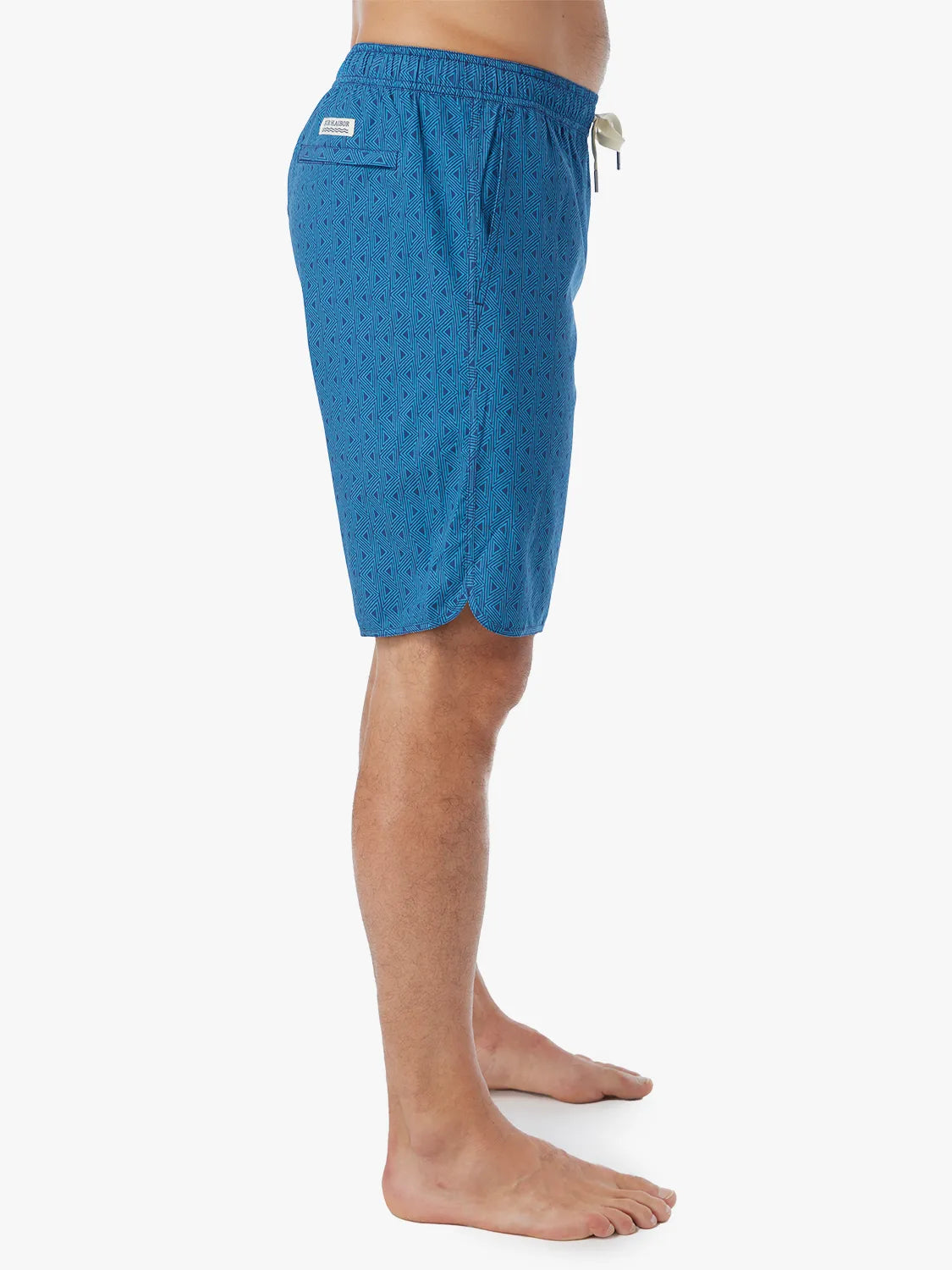 Person wearing electric blue geometric patterned Anchor Trunk in 10 inch inseam with a drawstring waistband and side view of trunk.