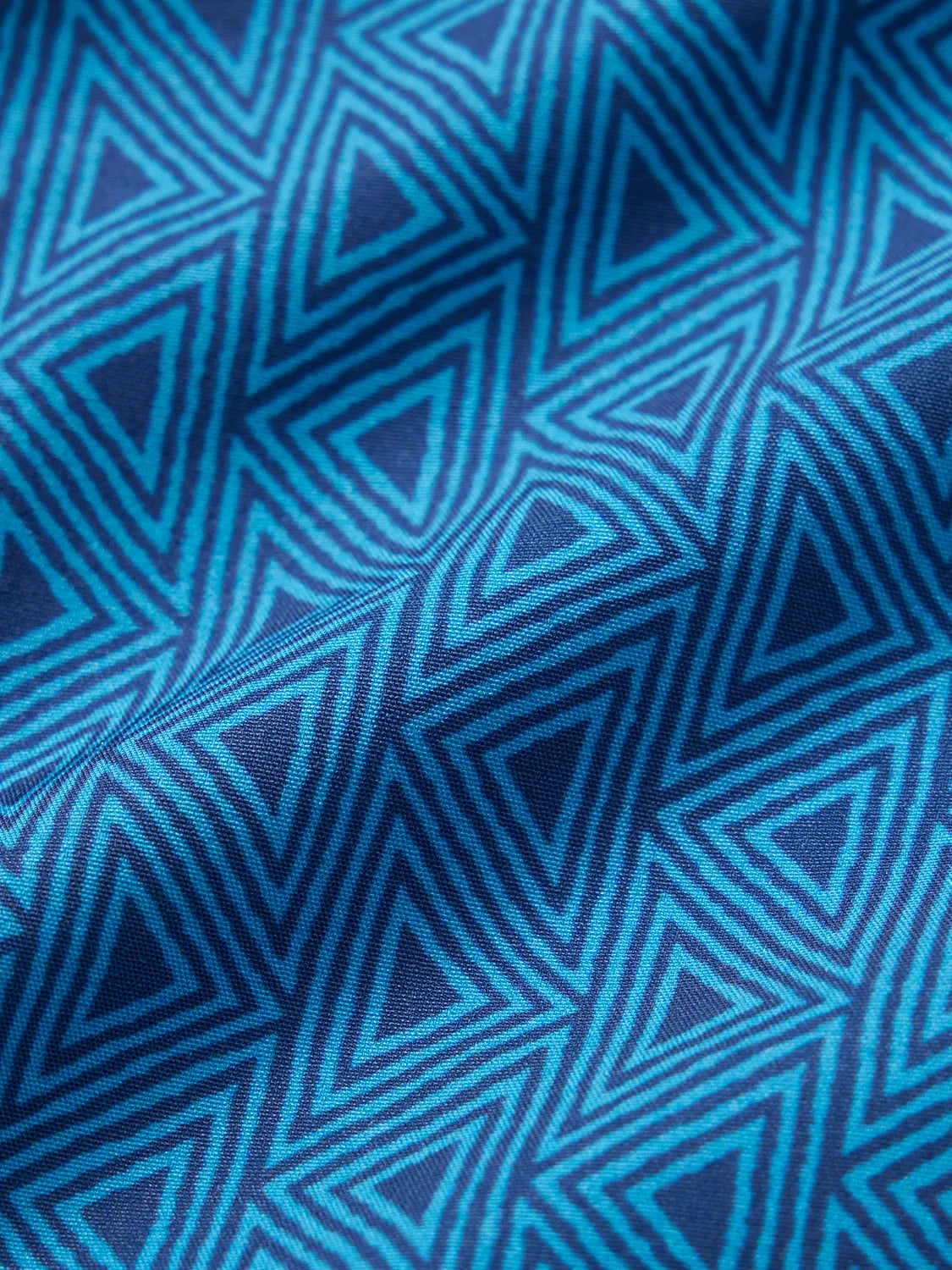 Swatch of Electric Blue Geo pattern fabric.
