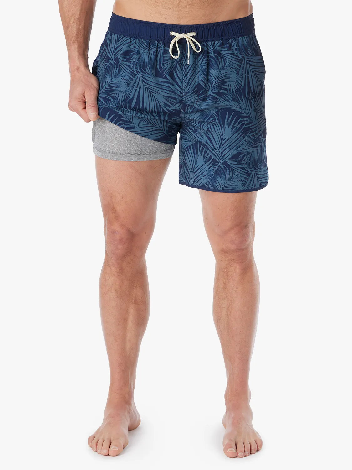 Person wearing grey and navy floral  patterned Anchor Trunk in 6 inch inseam, showing liner on a white background