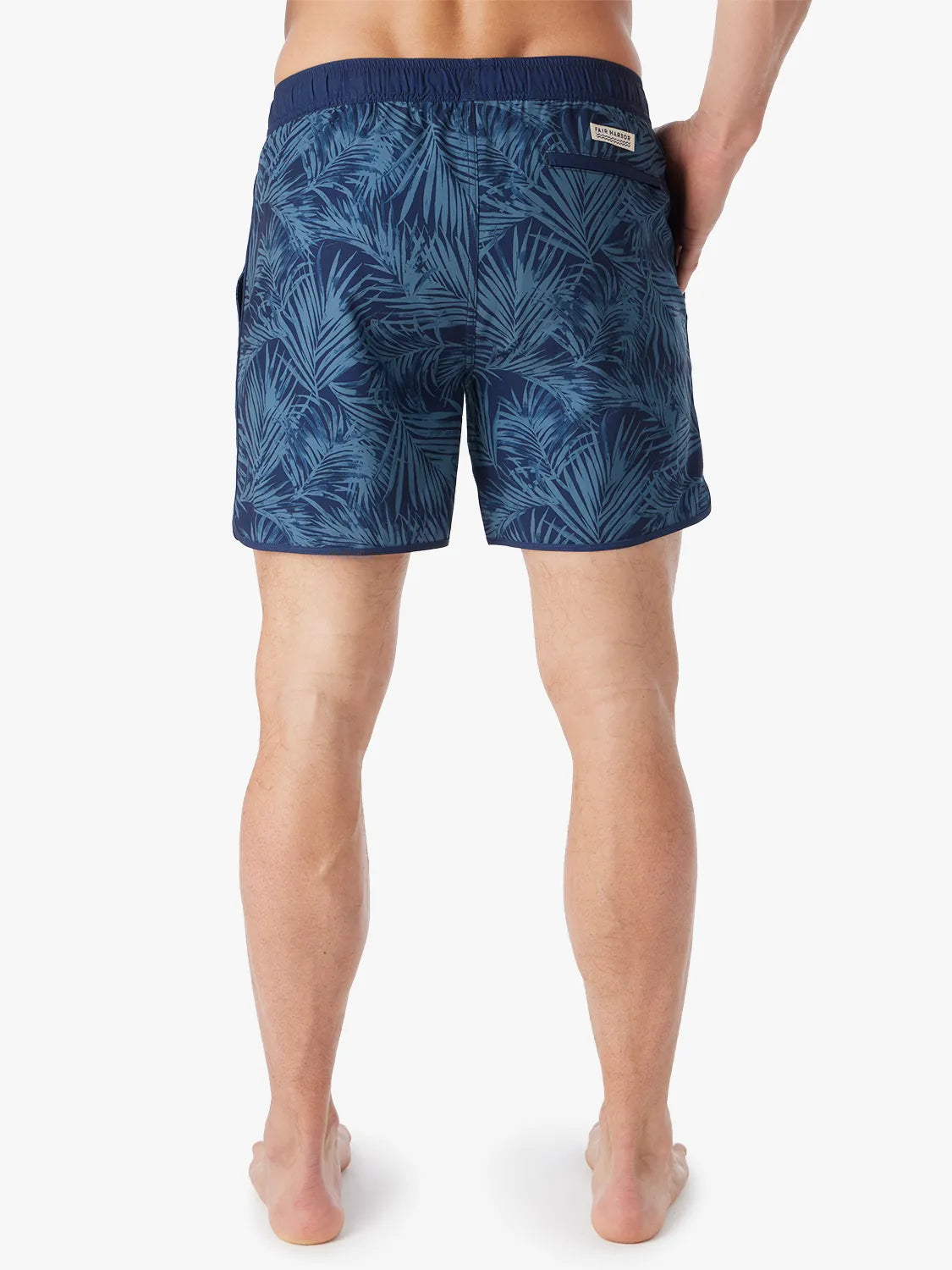 Person wearing grey and navy floral  patterned Anchor Trunk in 6 inch inseam, showing back view on a white background