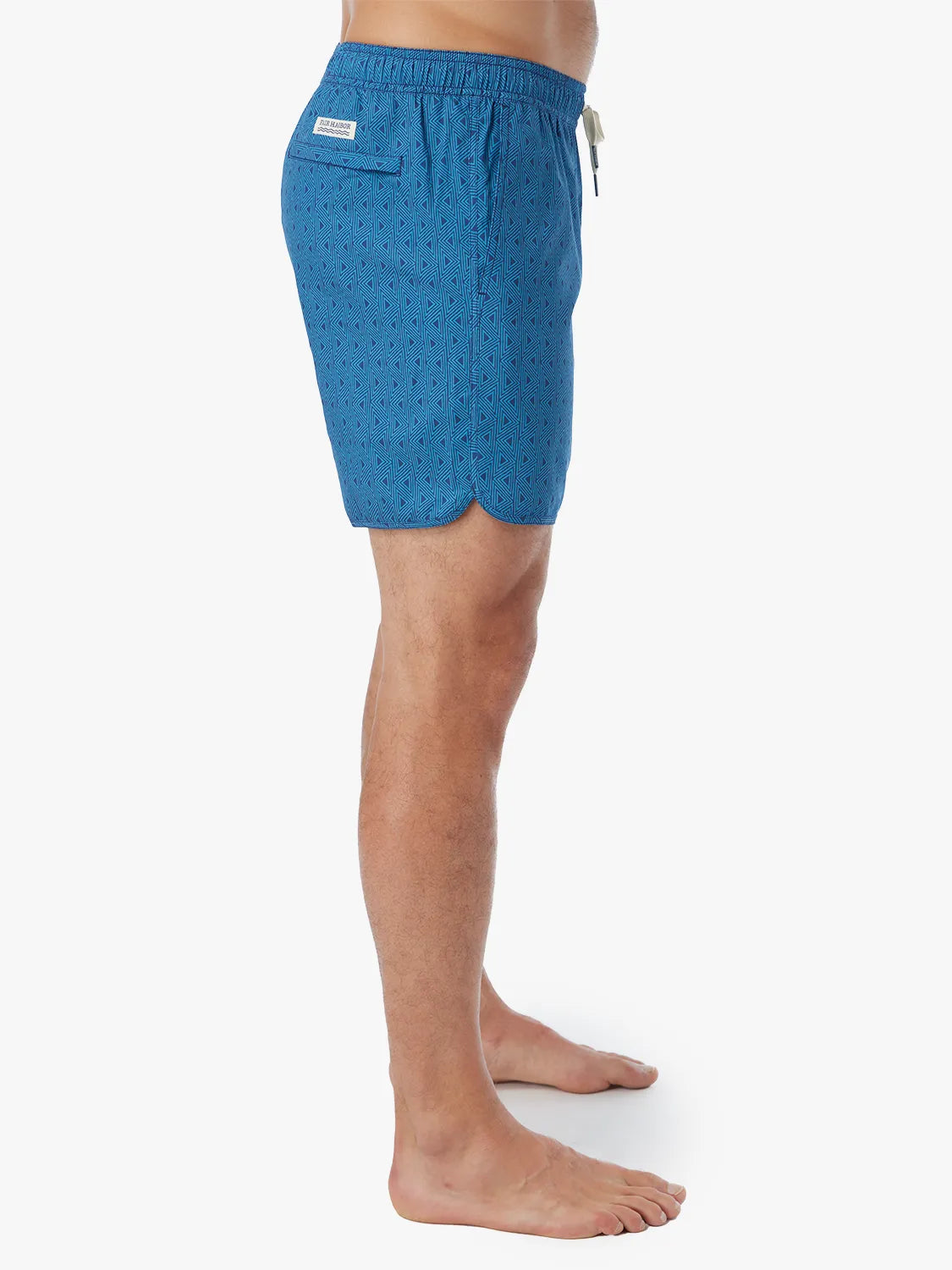 Person wearing electric blue geometric patterned Anchor Trunk in 6 inch inseam with a drawstring waistband and side view of trunk.
