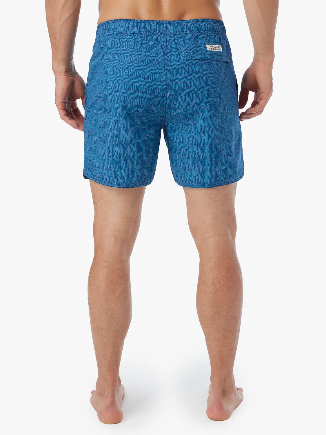 Person wearing electric blue geometric patterned Anchor Trunk in 6 inch inseam with a drawstring waistband and view of back.