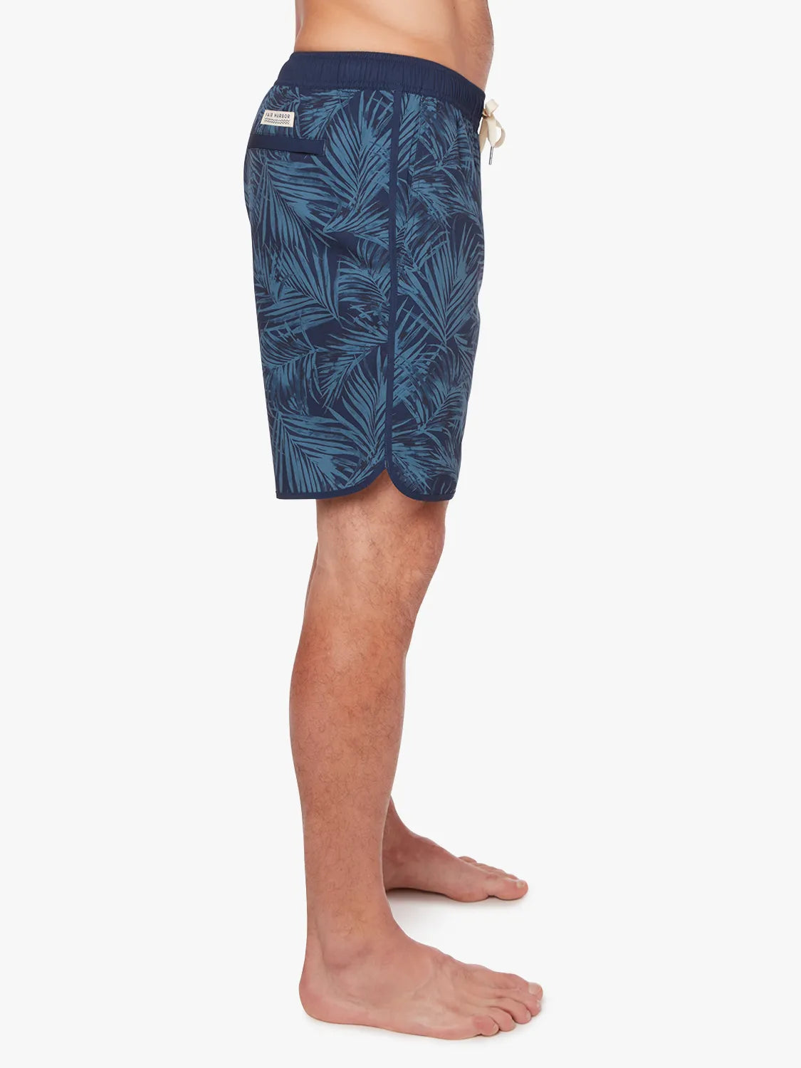 Person wearing grey and navy floral  patterned Anchor Trunk in 8 inch inseam, showing side view on a white background