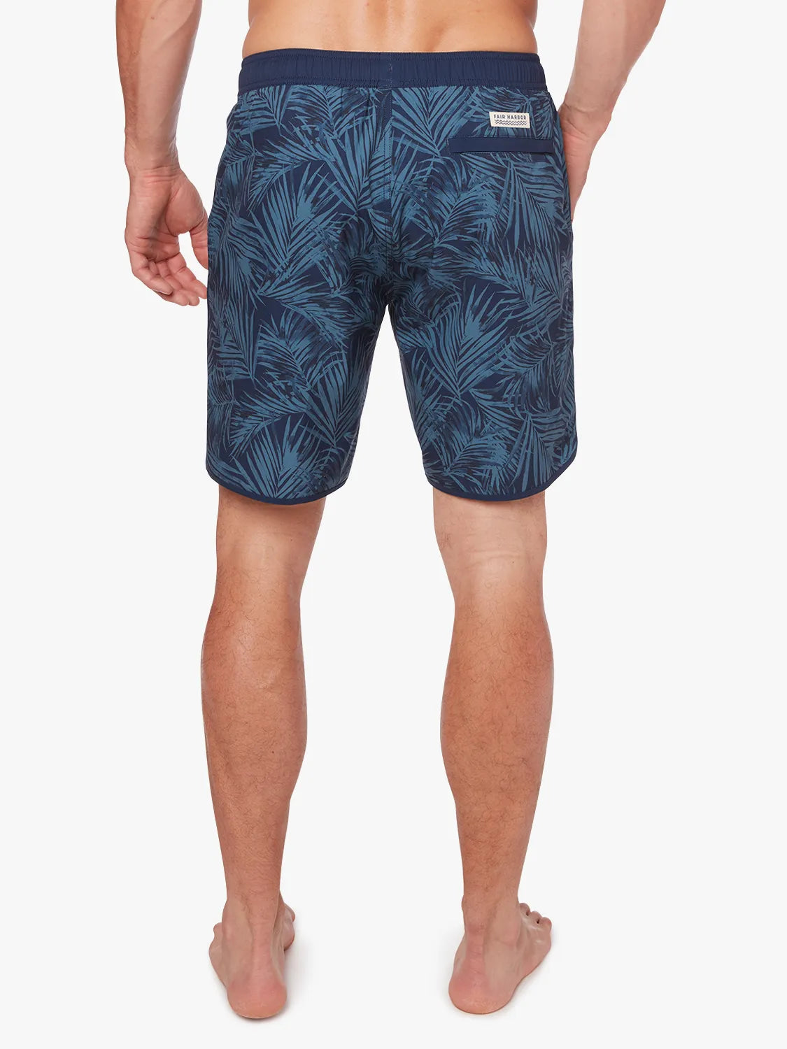 Person wearing grey and navy floral  patterned Anchor Trunk in 8 inch inseam, showing back view on a white background