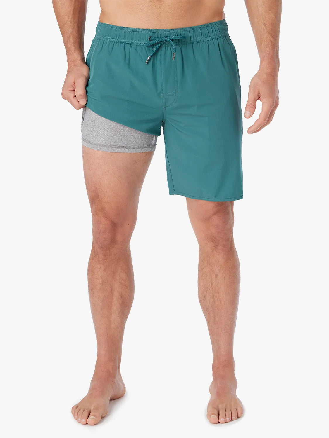 Person wearing 8 inch Anchor Trunk in seapine color, showing the liner on a white background.