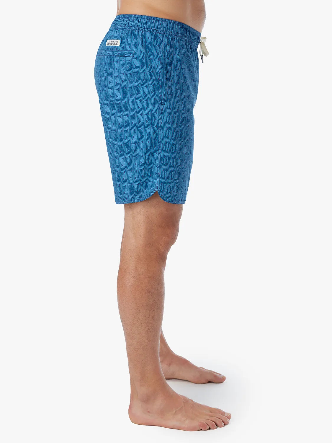 Person wearing electric blue geometric patterned Anchor Trunk in 8 inch inseam with a drawstring waistband and side view of trunk.