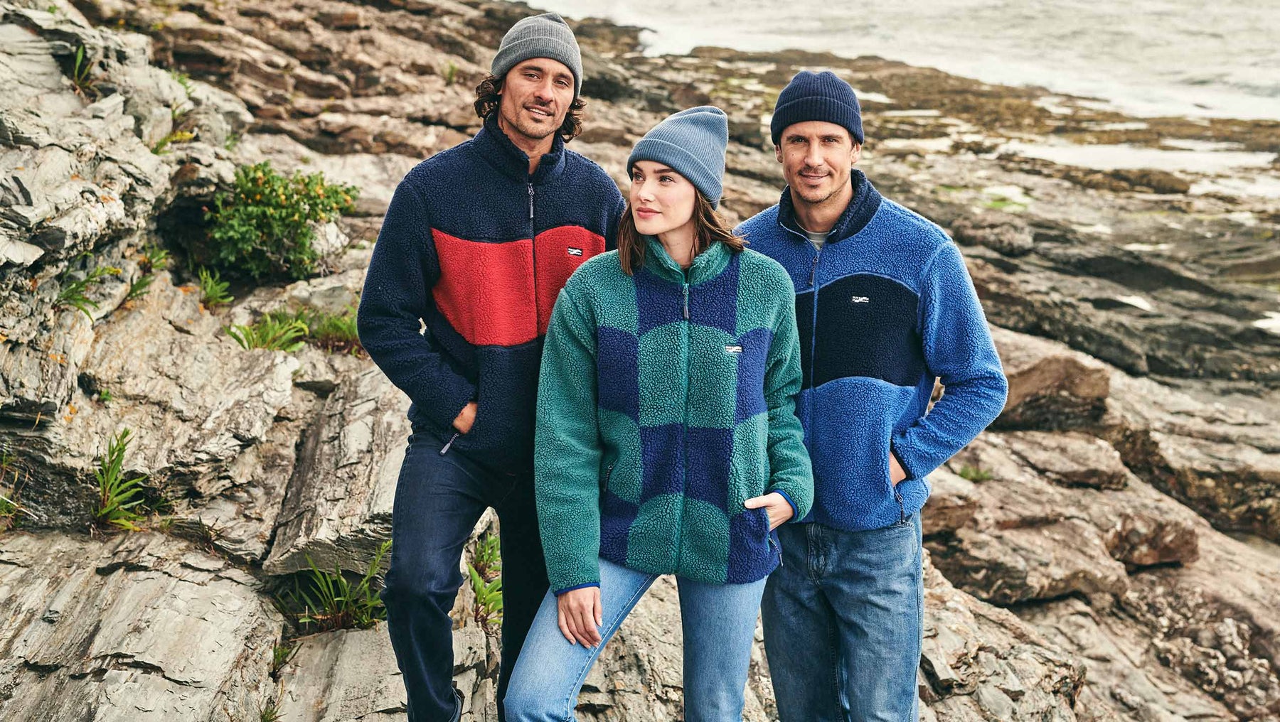 two men and 1 woman wearing fair harbor bayshore fleece jackets in 3 different colorways