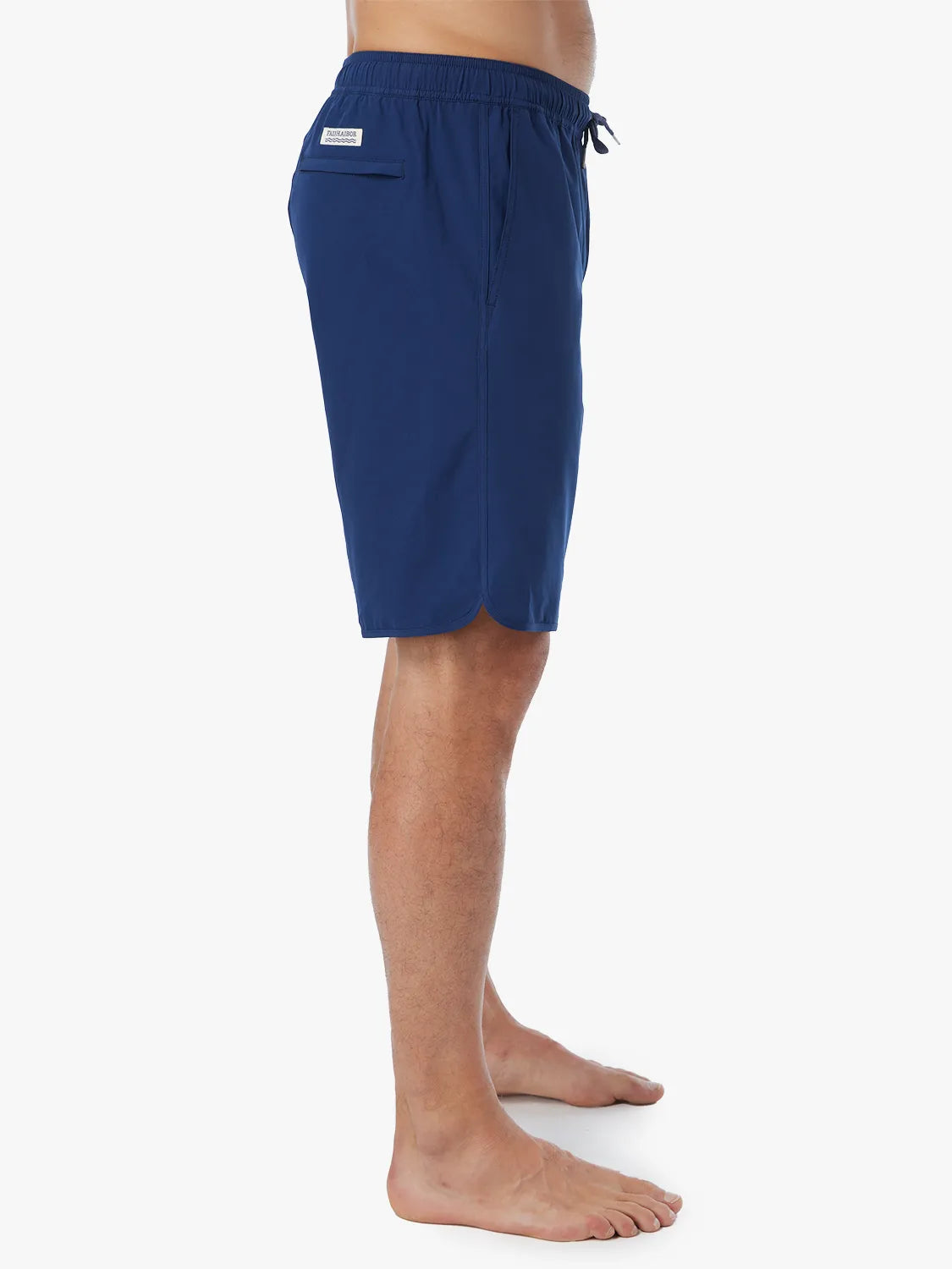 Person wearing navy-colored Anchor Trunk in 10 inch inseam showing the side view, displayed against a white background.