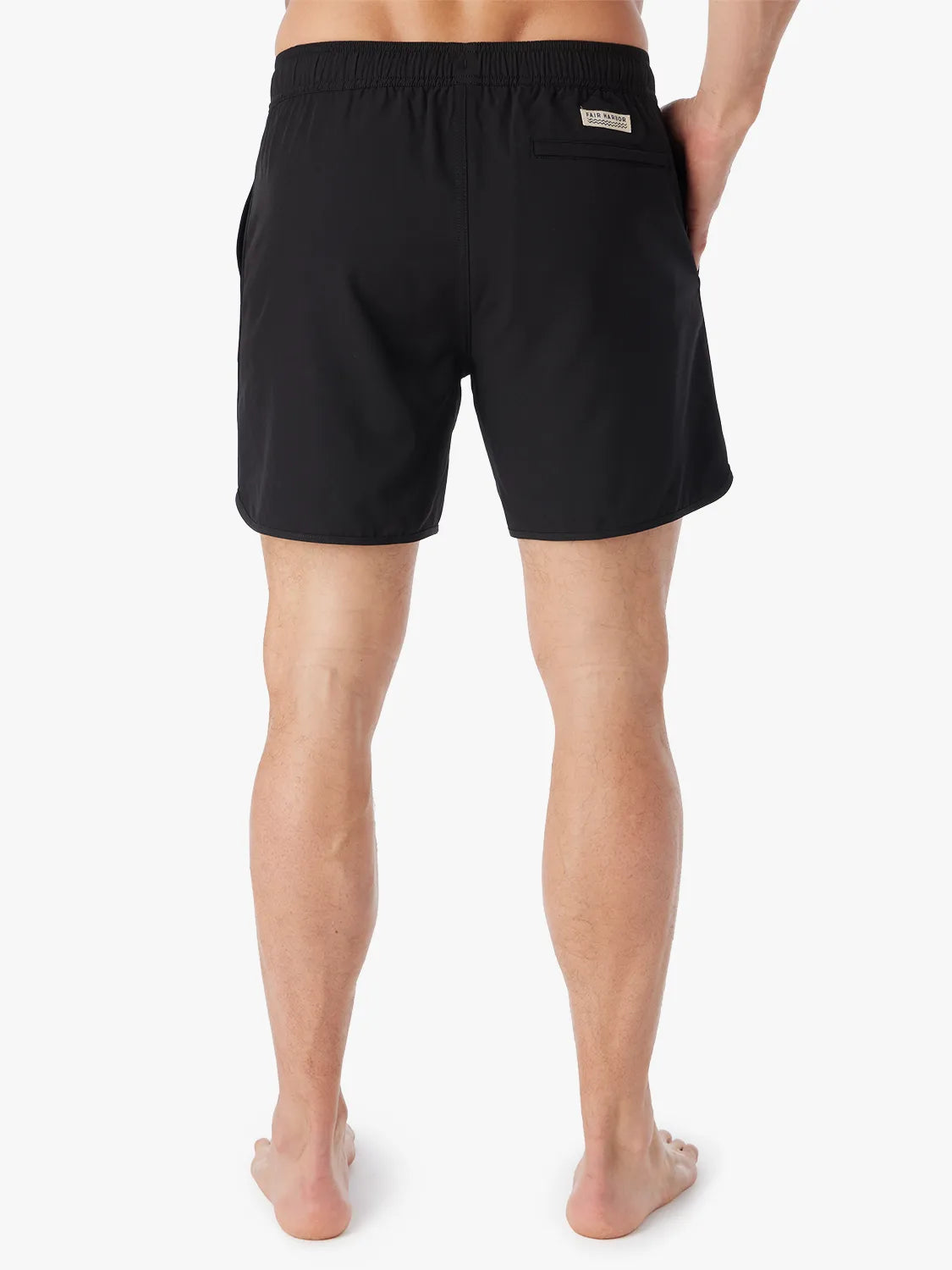 A person wearing a pair of black 6 inch Anchor Trunks on a white background, showing the back view.