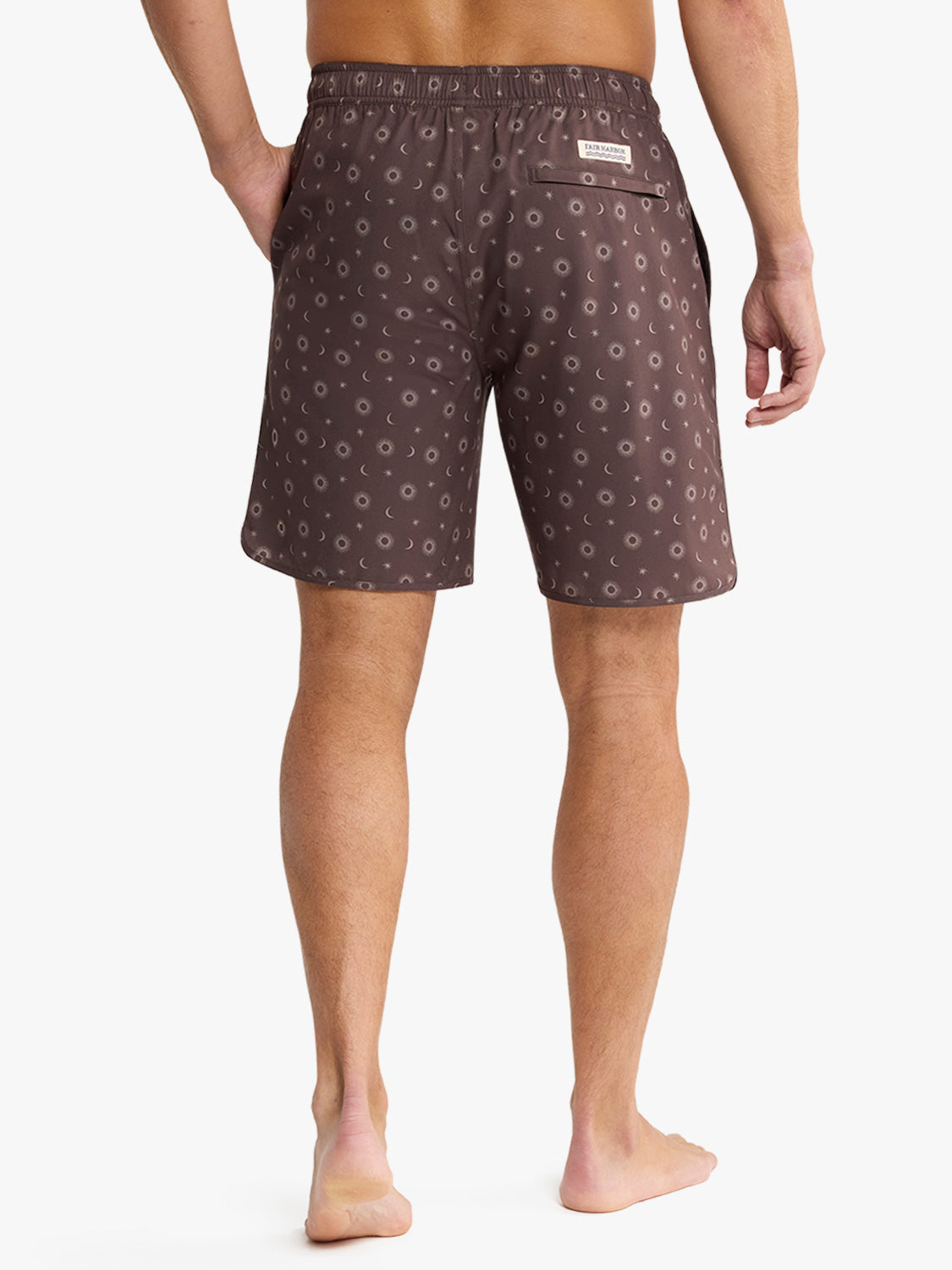 Man wearing patterned boxer shorts on a white background