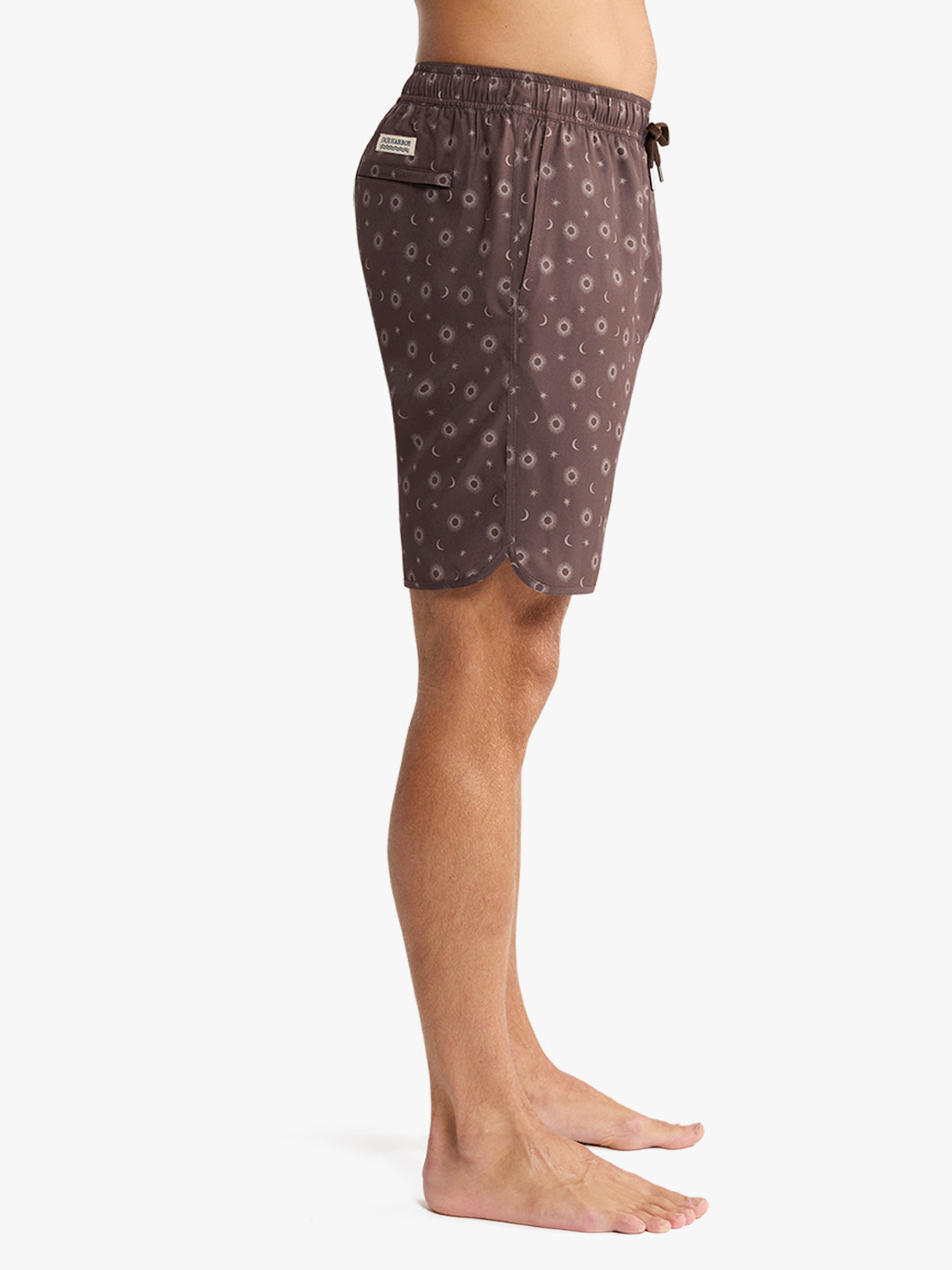 Patterned shorts worn by a person on a white background