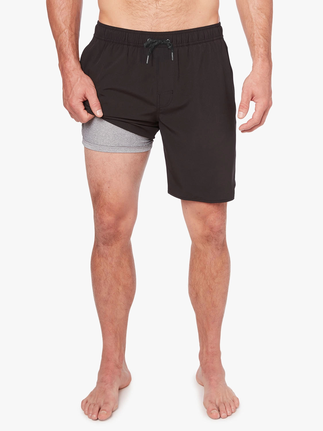 A person wearing a pair of black 8 inch Anchor Trunks on a white background, showing the short lining. 
