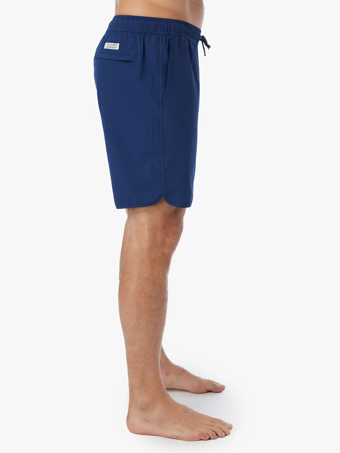 Person wearing navy-colored Anchor Trunk in 8 inch inseam showing the side view, displayed against a white background.