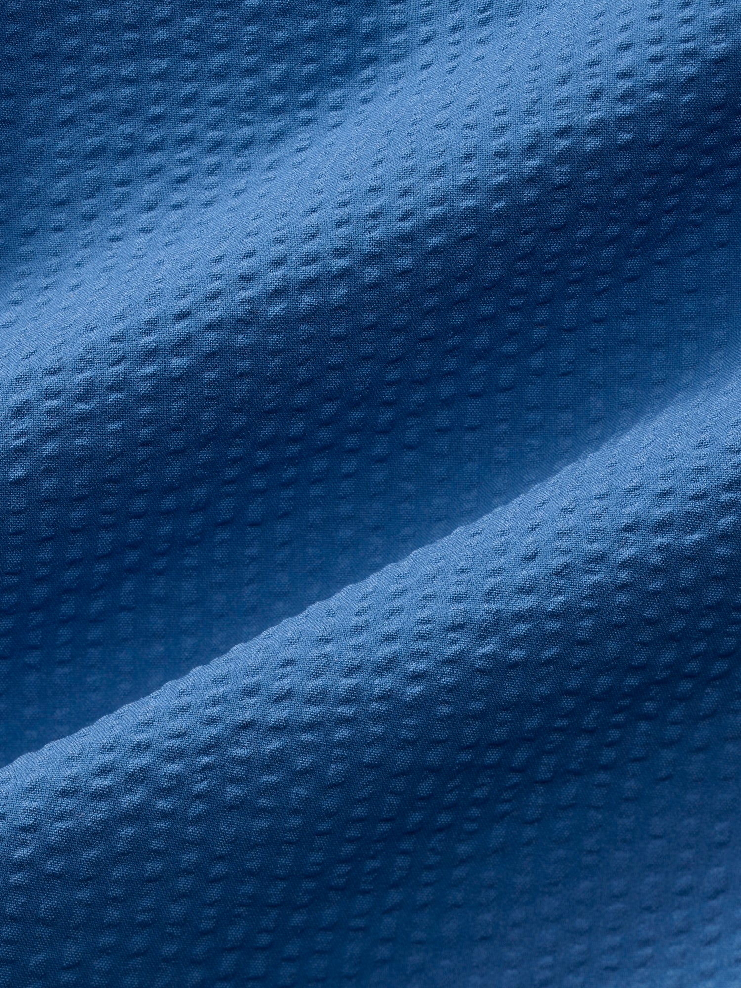 Close-up of textured blue fabric