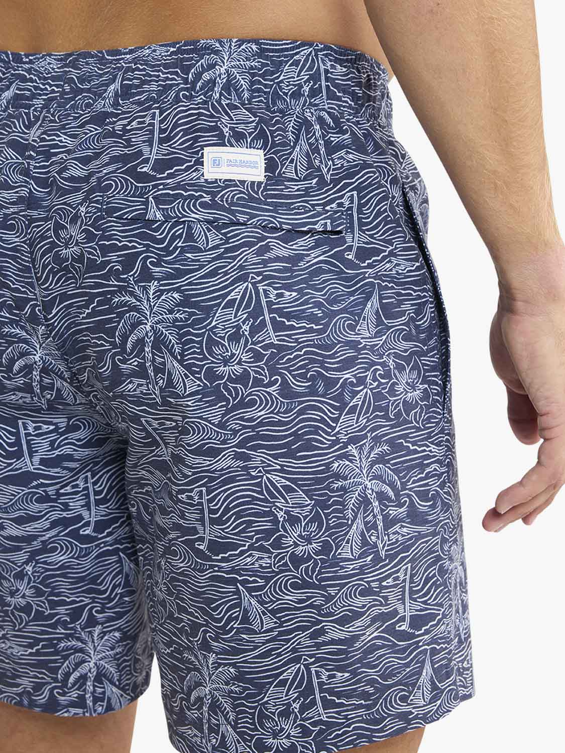 Navy blue shorts with white patterns on a white background