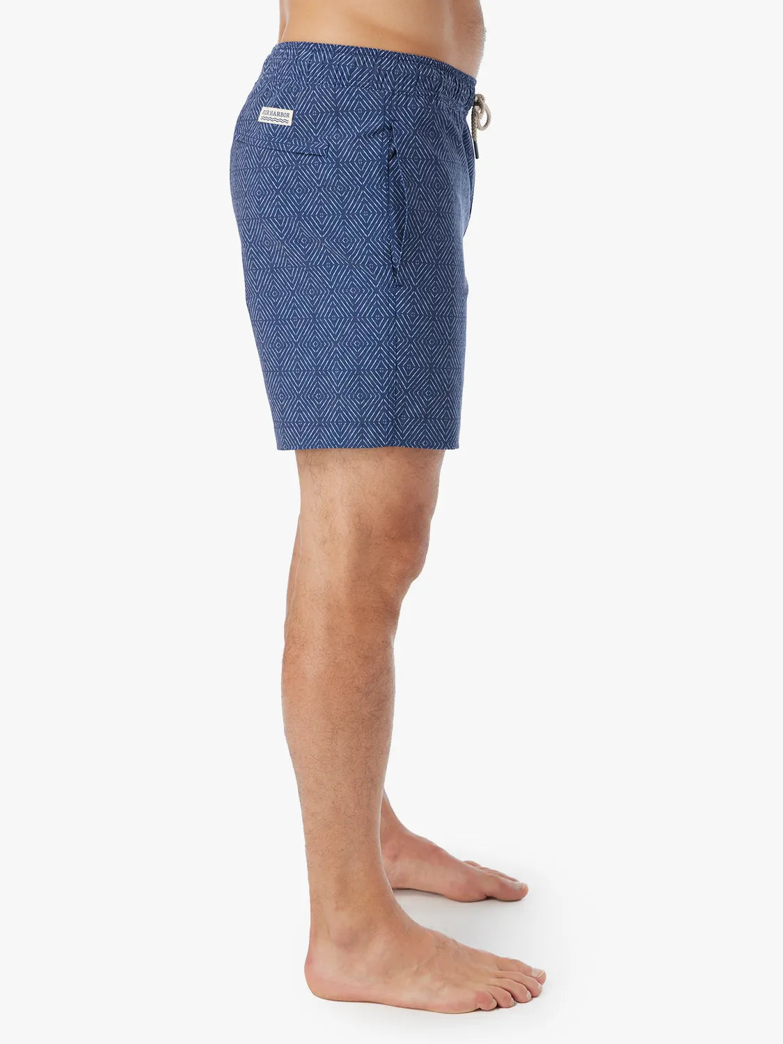 Person wearing Blue diamond patterned Bayberry Trunk with a drawstring and showing the side view against a white background