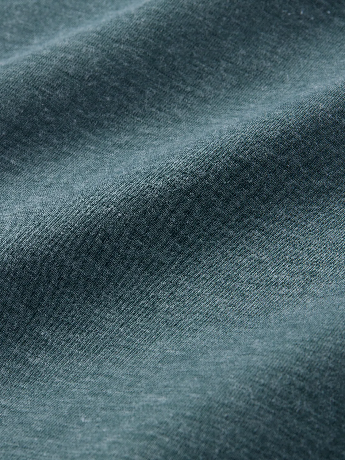 Close-up of olive green compass fabric