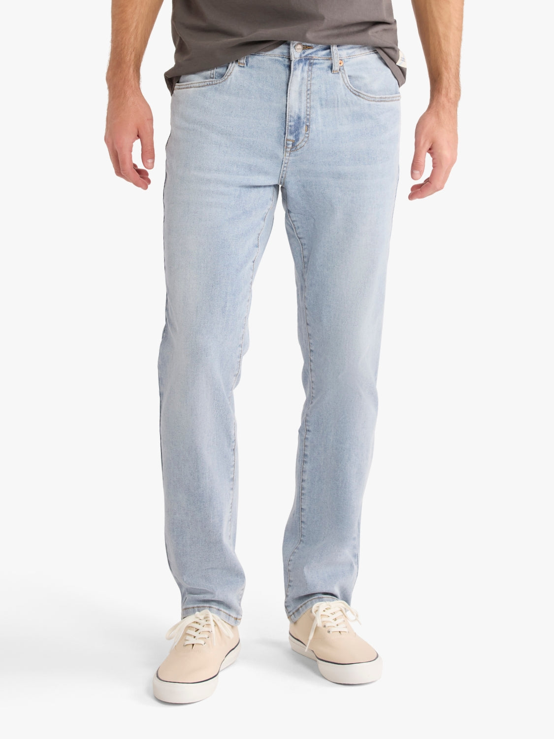 Light blue jeans from Fair Harbor worn by a person on a white background