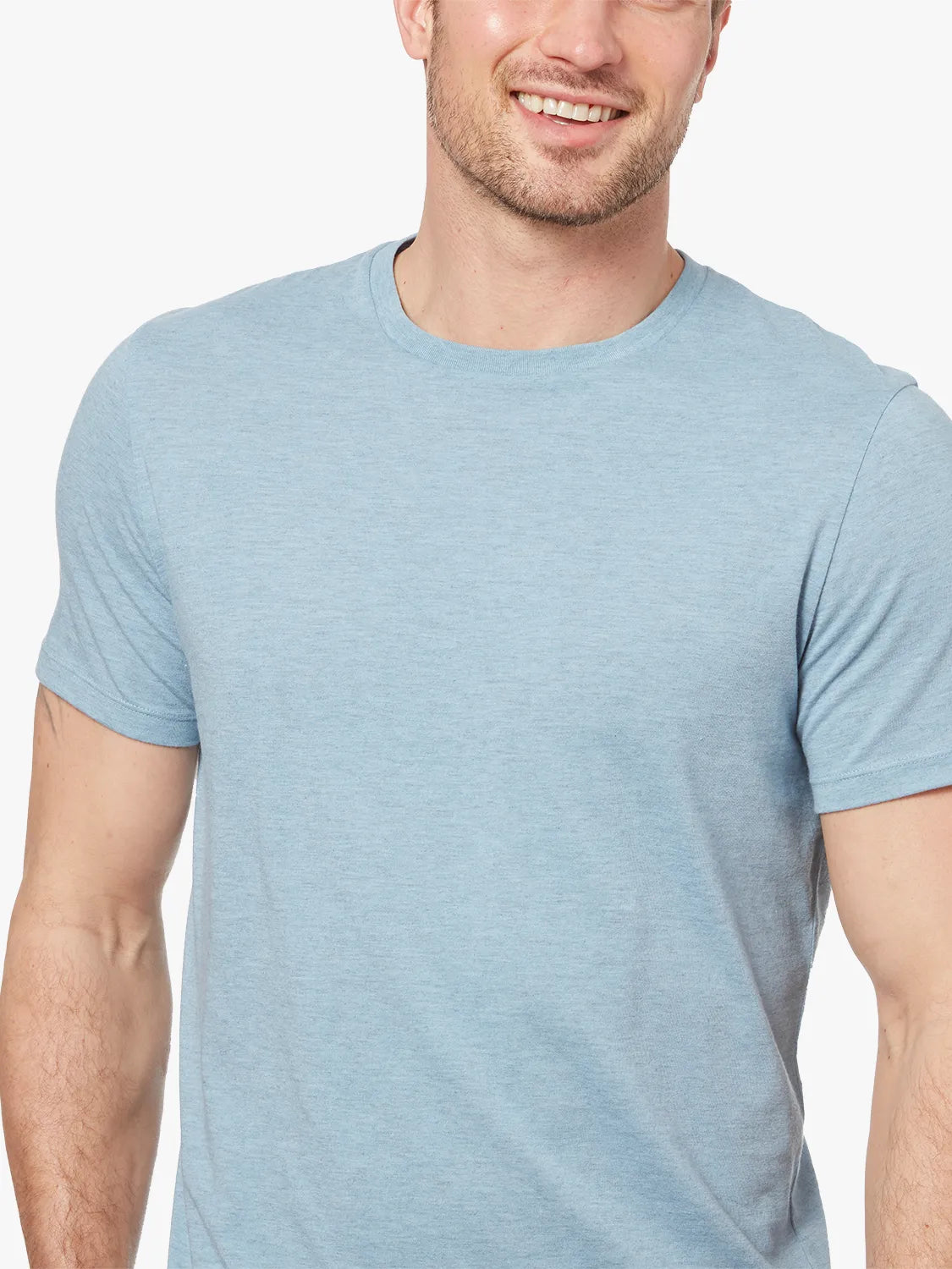 Close up of person wearing  light blue kismet tee fabric with white background 