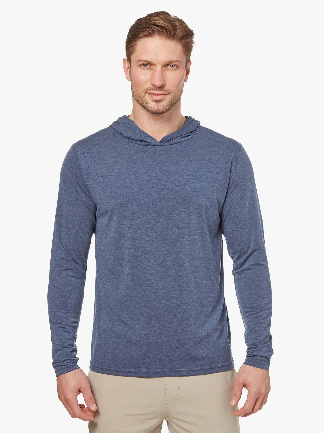 Person wearing navy blue seabreeze hoodie on a white background, paired with khaki pants. 
