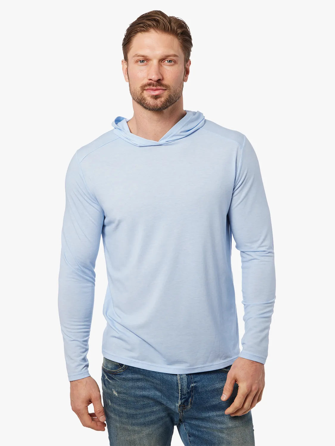 Person wearing light blue seabreeze hoodie on a white background, paired with denim pants. 