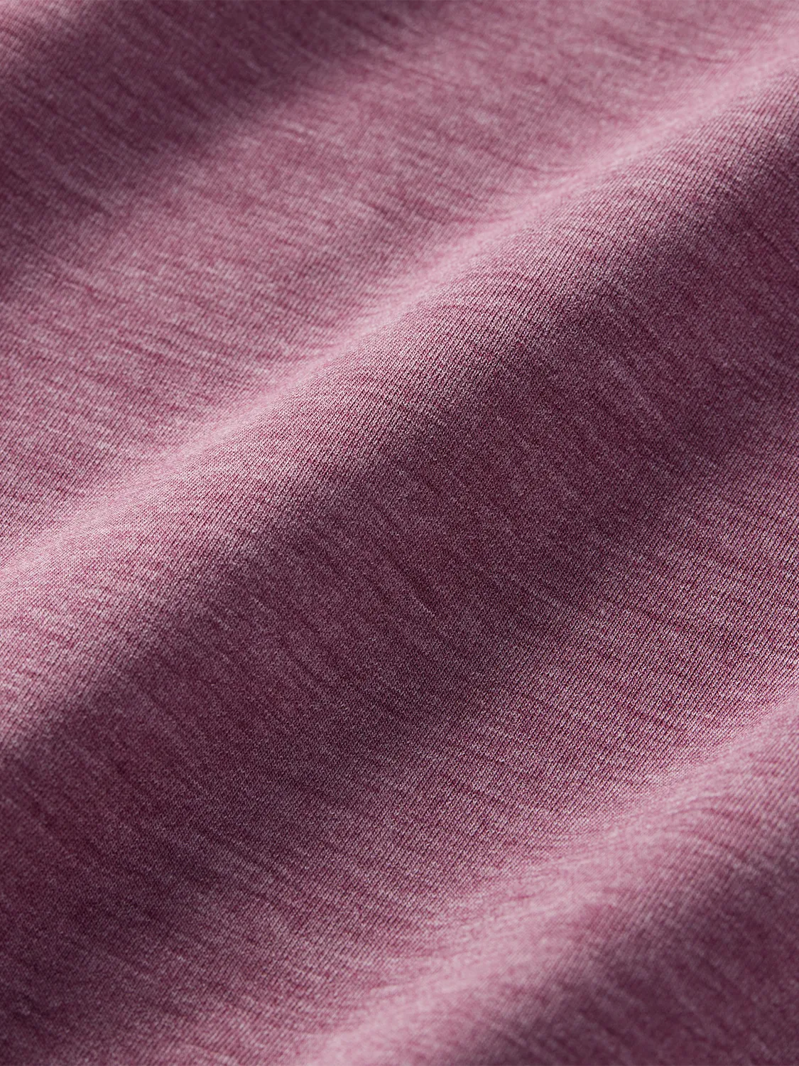 Close-up of a heathered red fabric surface