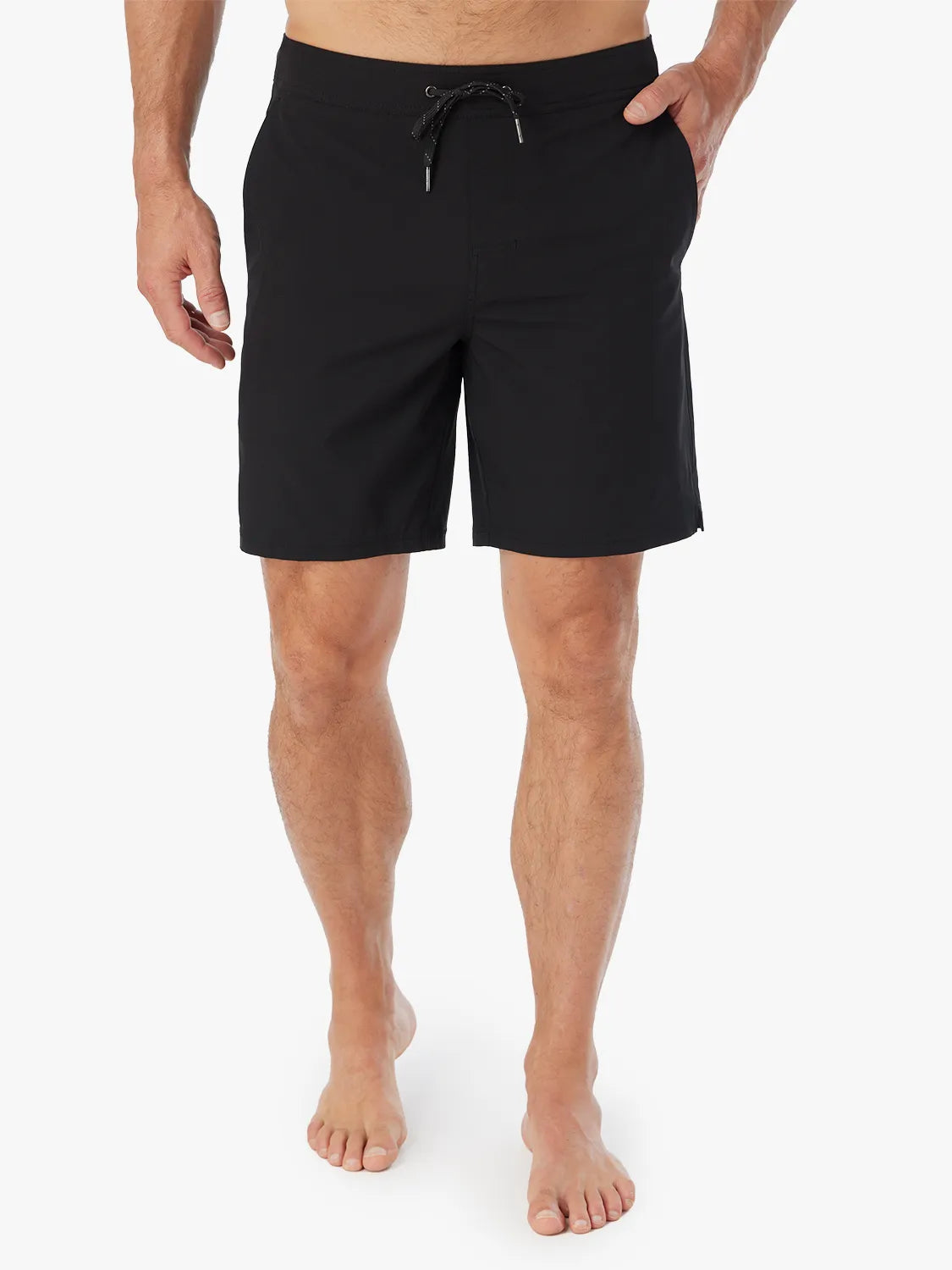 Person wearing pair of black Ozone shorts with drawstring on a white background