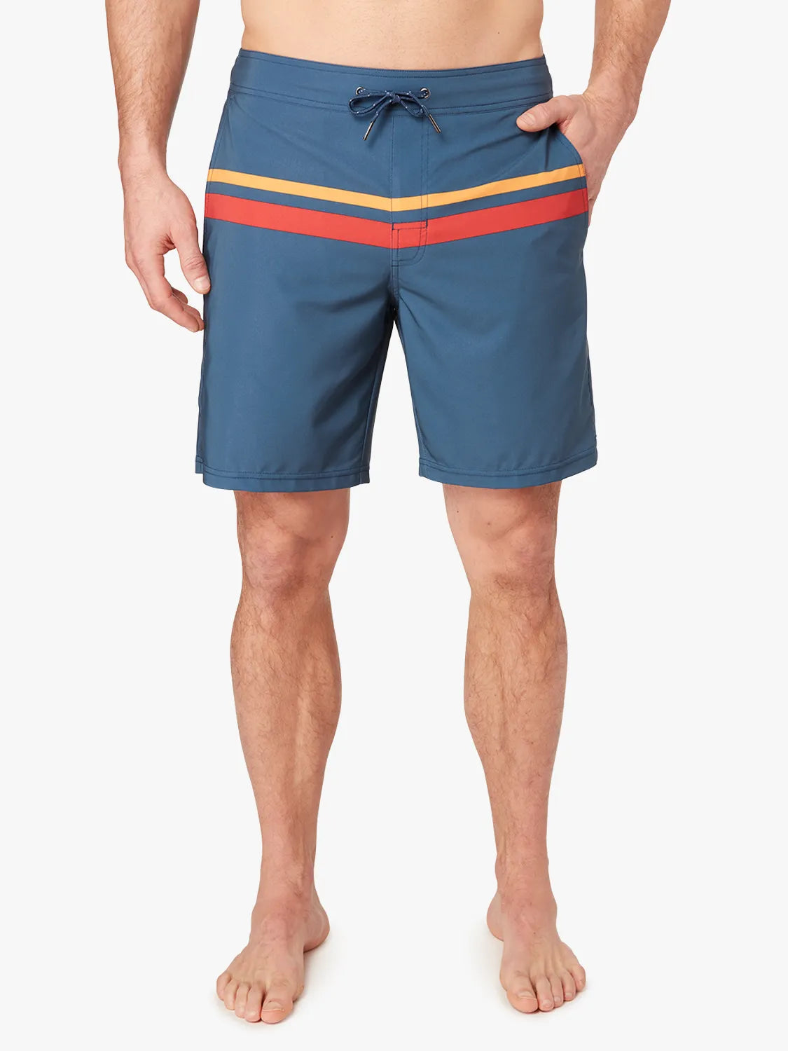 Person wearing a pair of ozone blue board shorts with red and yellow stripes on the upper part and a drawstring at the waist on a white background. 