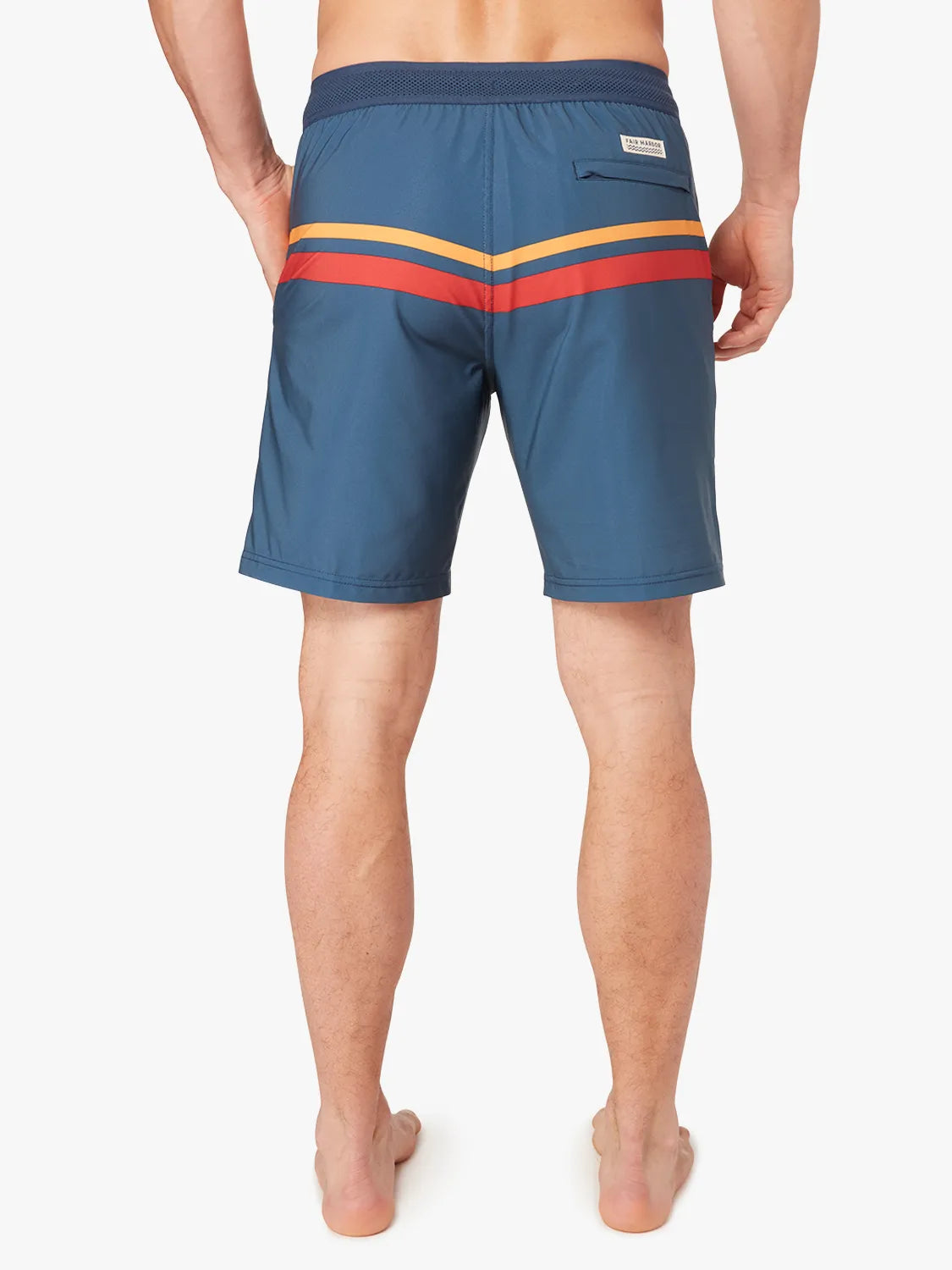 Person wearing a pair of ozone blue board shorts with red and yellow stripes on the upper part and a drawstring at the waist on a white background. Showing the back view. 