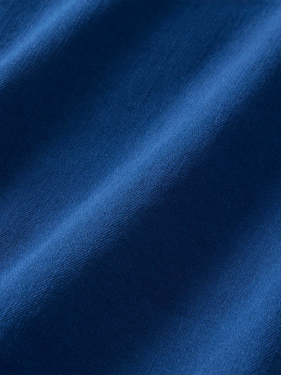 Close-up of blue seaport chore jacket fabric. 