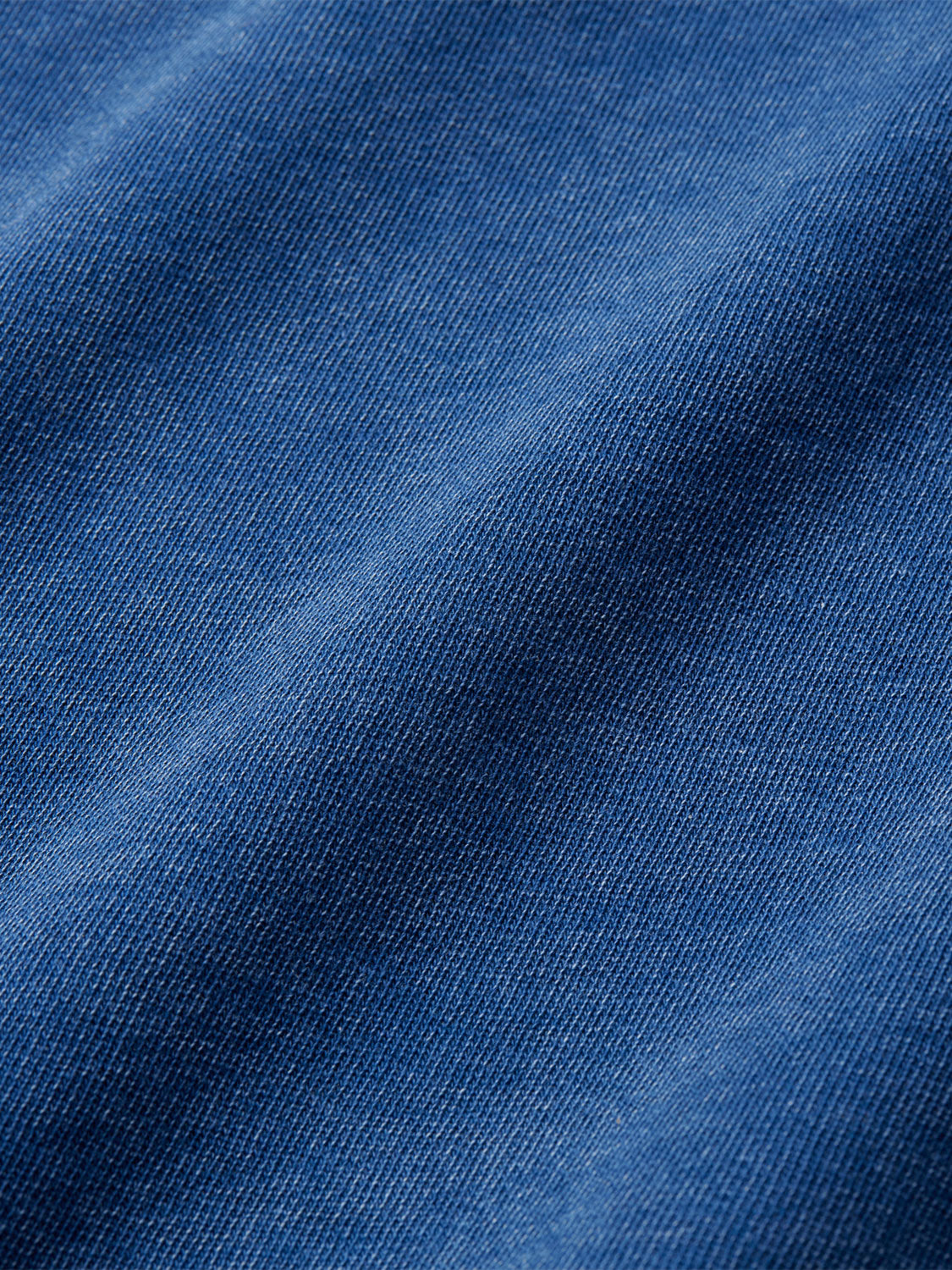 Close-up of navy blue saltaire fabric. 