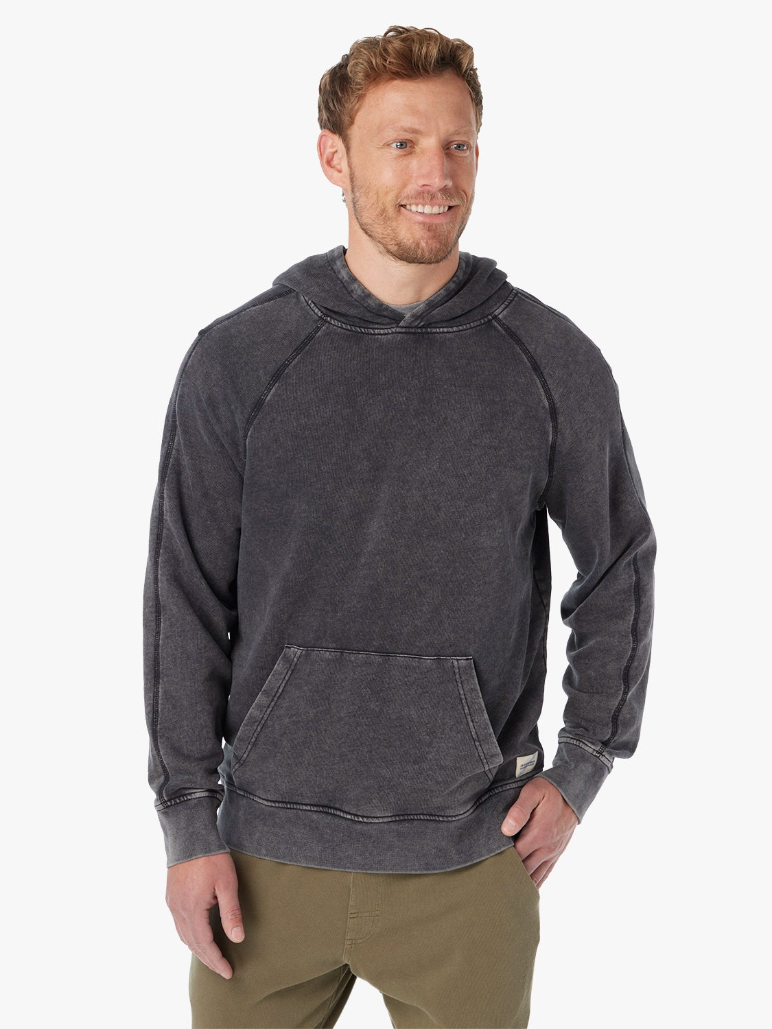 Man wearing a black saltaire hoodie on a white background, showing the front view.