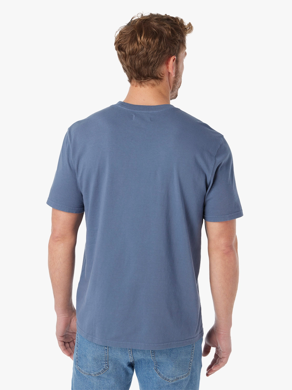 Man wearing a blue Saltaire t-shirt against a white background