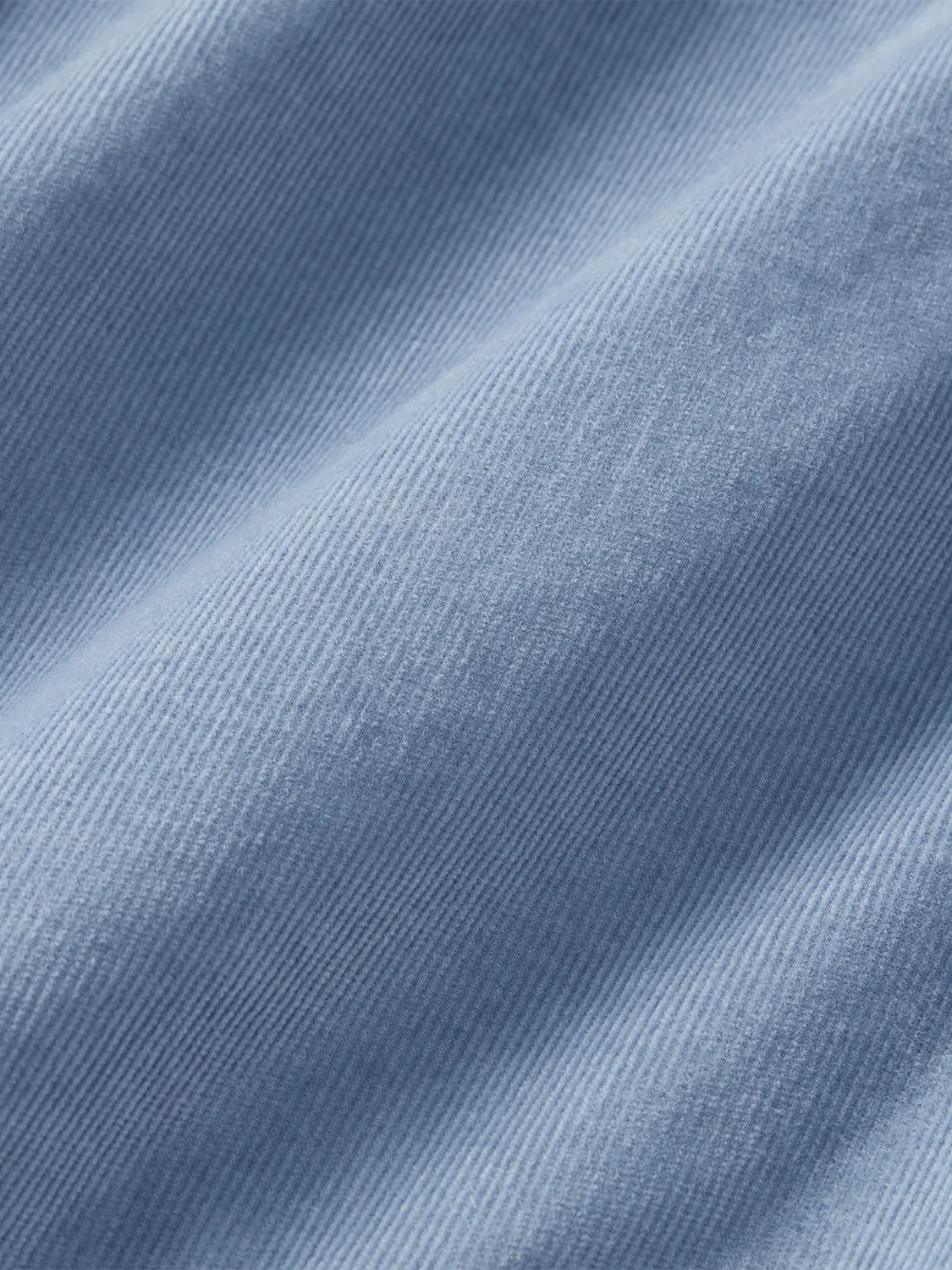 Close-up of blue wilder corduroy fabric. 